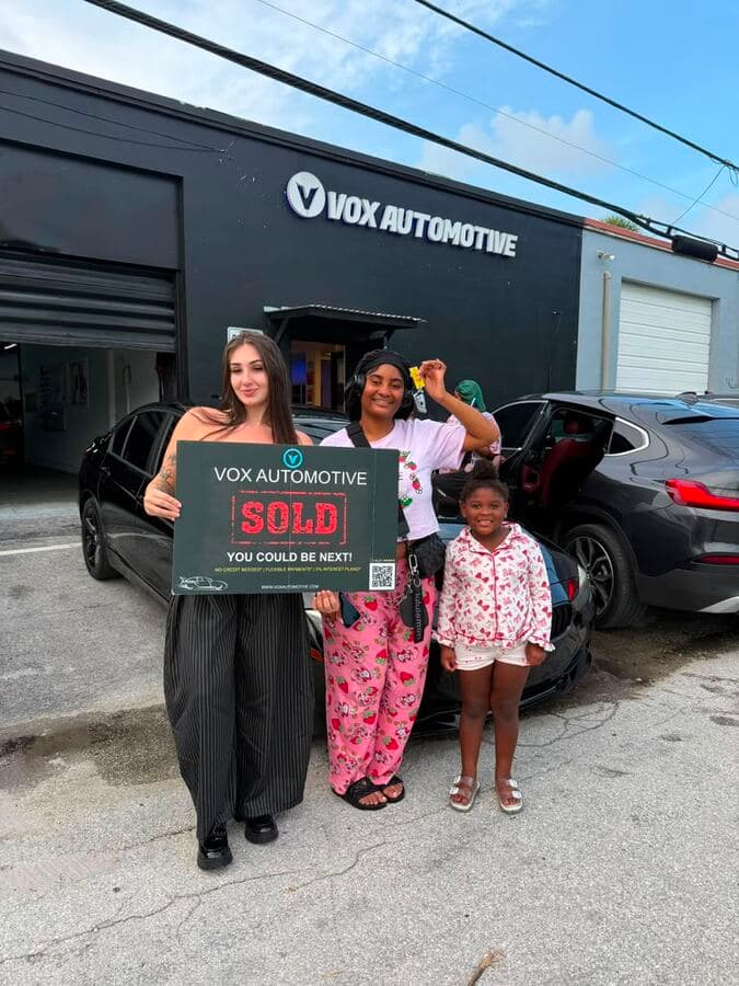Vox Automotive customers celebrating with their new car